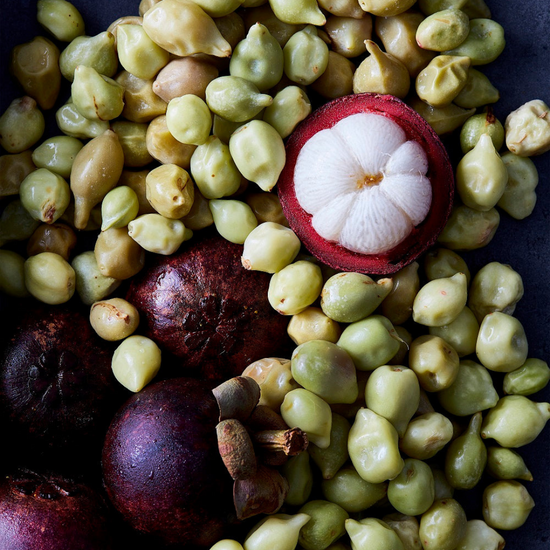 A close-up of Mangosteen and seeds on Spa Circle Brands product listing page.