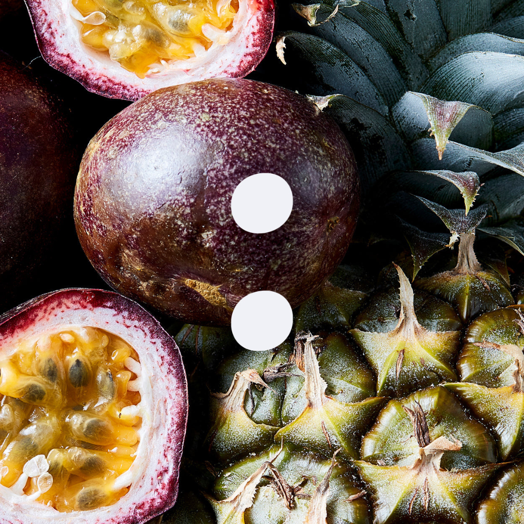A close-up of  Passionfruit & Pineapple fruit with an Earthen logo in the middle on Spa Circle Brands product listing page.
