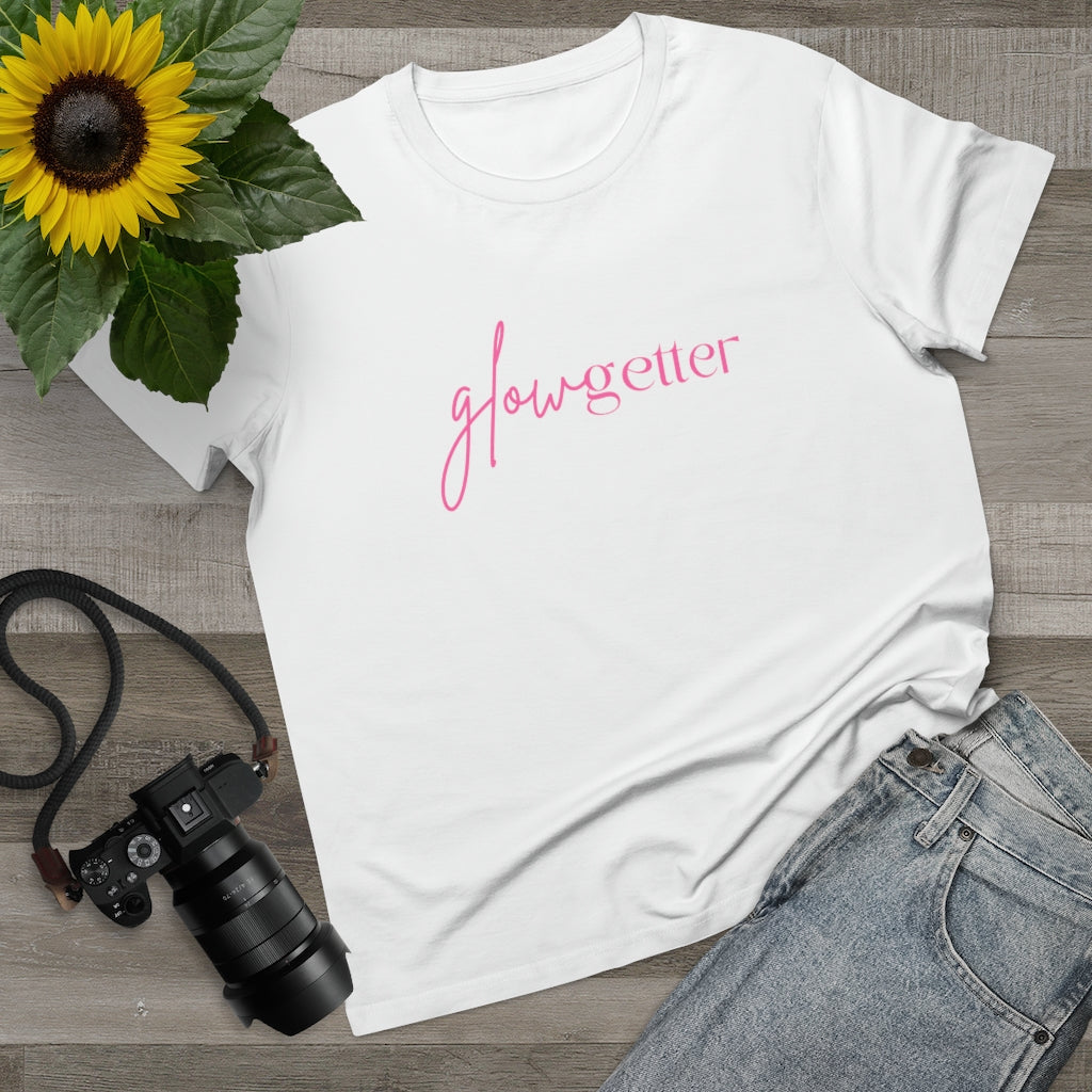 A white t-shirt with a glowgetter design on it beside the jeans, camera, and sunflower, on Spa Circle Brands product listing page.
