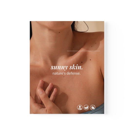 A woman's collarbone adorned with the phrases Sunny Skin Nature's Defense, set against a white background. This poster is from Spa Circle Brands' product listing page.