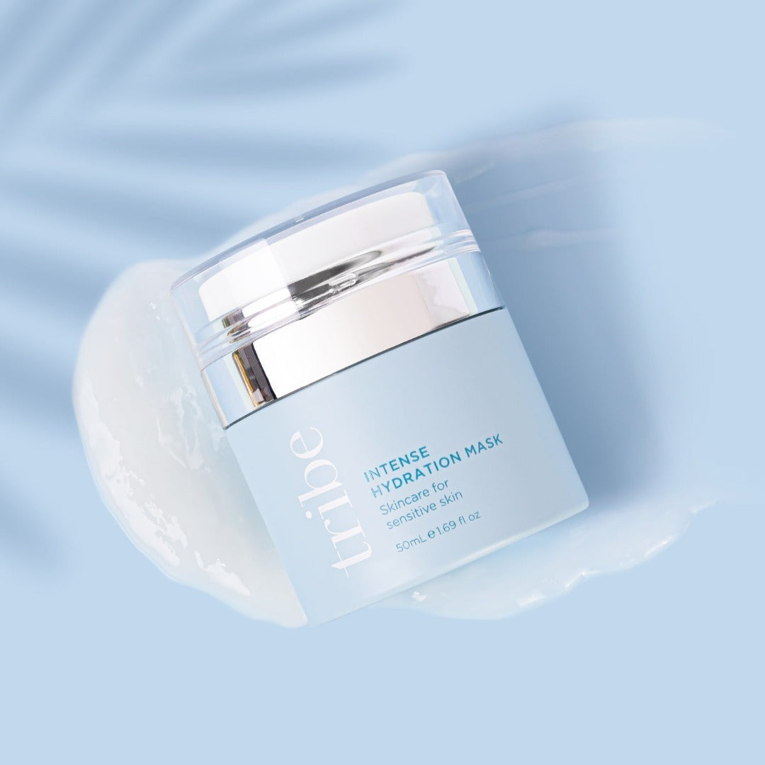 Airless pump bottle of Tribe Intense Hydration Mask and its products on a light blue background, showcased on Spa Circle Brands' product listing
