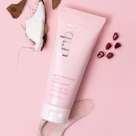 Artistic portrayal of Tribe Resurfacing 2-in-1 Exfoliant against a light pink background, highlighted on Spa Circle Brands' product listing.